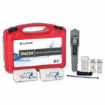 A red carrying case labeled LaMotte Total Chlorine TRACER - 1740-KIT-01 with a digital tester, small sample containers, two boxes of test tablets, a blue stir stick, and a black cord displayed in front.