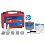 The ColorQ® 2x Drinking Water Kit - 2101 features a red carrying case, vials, bottles, brush, color comparator, Bluetooth icon, and reagent packets neatly arranged on a white background.