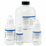 Four bottles of phenolphthalein indicator solution, a titration reagent for alkalinity, in various sizes with white caps and labels displaying product information, arranged against a plain white background.