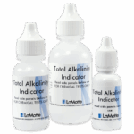 Three dropper bottles labeled Total Alkalinity Indicator by LaMotte, used for chemical tests, are displayed standing upright against a white background. The bottles vary in size.