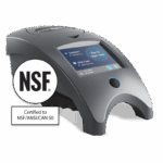 A sleek, gray WaterLink Spin Touch - 3580 device with a digital touchscreen display sits next to a large NSF certification badge labeled Certified to NSF/ANSI/CAN 50.