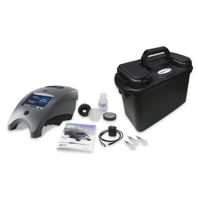 A portable silver and black WaterLink Spin Touch BC - 3586 water testing device kit, including a main unit, black carrying case, instruction manual, cables, power adapter, small containers, and sample vials arranged on a white background.
