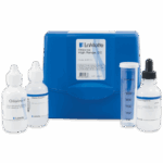 A blue Chlorine Test Kit - 4497-01 case with three reagent bottles, a dropper bottle, and a clear plastic graduated test tube for chlorine testing, all neatly arranged in front of the case.