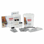 The Urban Water Test Kit features test tubes, chemical packets, a measuring strip, instructions, and a white container, all neatly arranged on a white surface for easy water quality testing.
