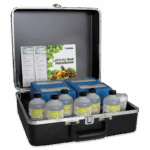 An open black carrying case containing bottles labeled Universal Extract Solution, blue plastic boxes, the LaMotte Soil Handbook, and various papers—all neatly arranged inside as part of the Soil Micronutrients Outfit - 5938-02.