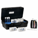 A black carrying case with test tubes, boxes of test tablets, a white stirring stick, and a color comparator for water testing—this Chlorine and pH Test Kit - 6980-01 is neatly arranged on a white background.