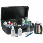 A black plastic case open to display the Alabama Water Quality Monitoring Kit - 9844-02, featuring bottles of chemicals, test tubes, a color comparator, and other lab tools neatly arranged inside and in front of the case.