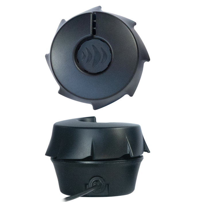 Two black circular plastic devices with ridged edges, one positioned above the other. The top device has a wave-like logo in the center, while the bottom one is connected to a cable. Both are set against a plain white background.